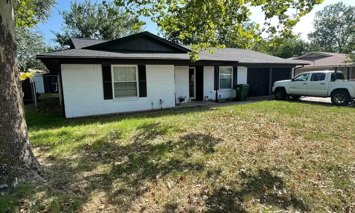 Professional roofing crew working on a residential roof in Oconomowoc